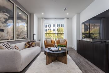 Contemporary living room with round coffee table and seating